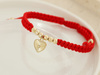 Bransoletka złota serce i kulki na czerwonym sznurku