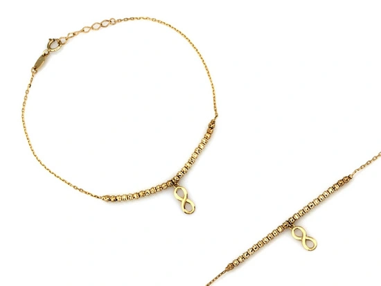 Złota bransoletka z kulkami i wiszącą nieskończonością