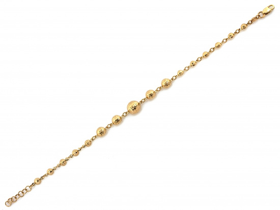 Złota bransoletka z kulkami błyszcząca efektowna