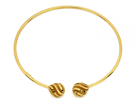 Złota bransoletka sztywna z ażurowymi kulkami