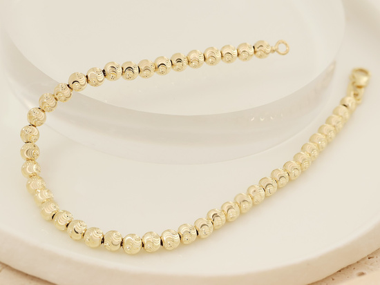 Złota bransoletka damska z diamentowanych kulek