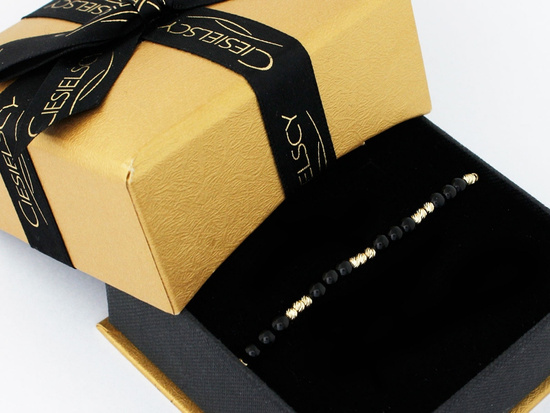 Bransoletka złota i czarne kulki na czarnym sznurku