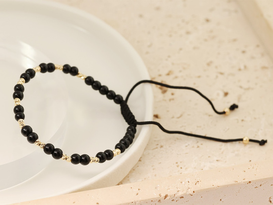 Bransoletka sznurkowa złote i czarne kulki