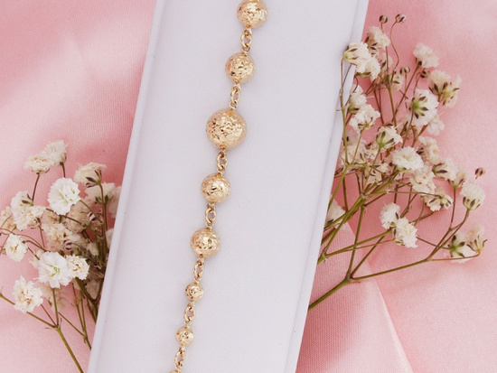 Złota bransoletka z kulkami błyszcząca efektowna