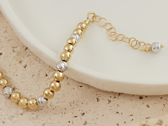 Bransoletka złota z dwukolorowych  kulek 4mm