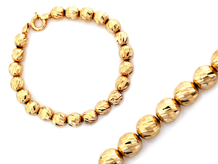 Złota bransoletka z dużych frezowanych kulek