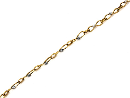 Bransoletka złota przeplatana z kulkami z białego złota