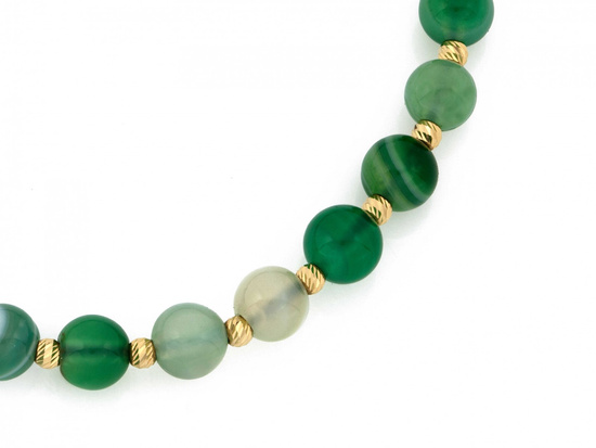 Bransoletka złote kulki i zielone kamienie na czarnym sznurku