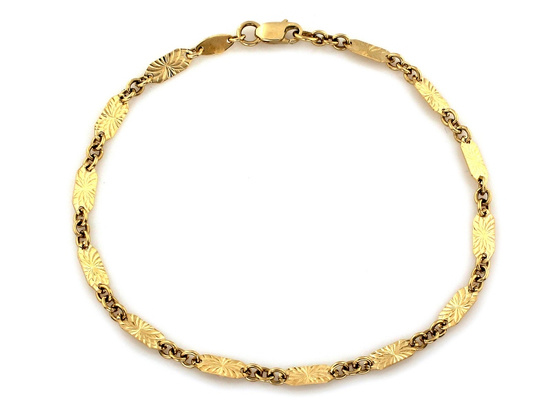 Złota bransoletka z owalnych frezowanych blaszek