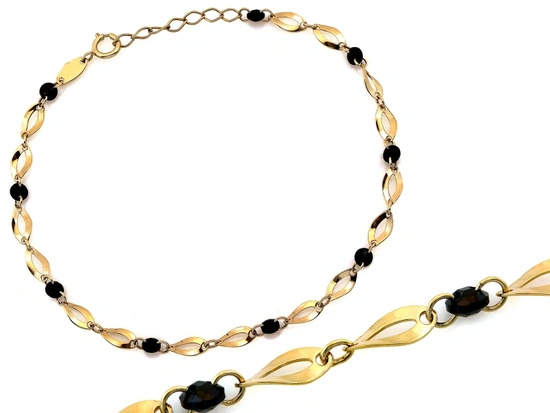 Złota bransoletka owalne ogniwa czarne kamienie