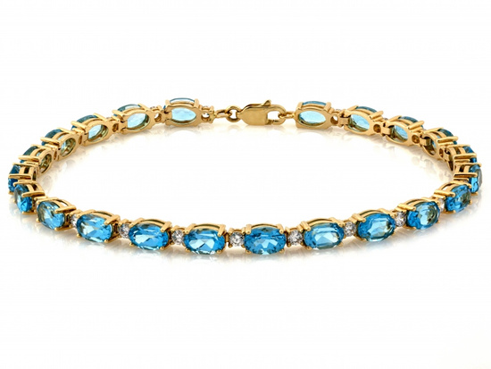 Bransoletka złota z owalnymi niebieskimi kamieniami