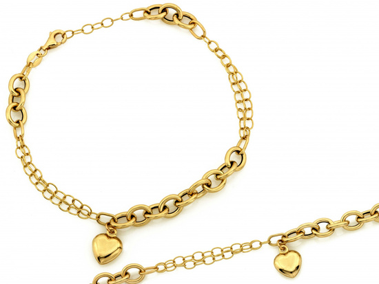 Złota bransoletka z łączonych różnych łańcuszków z wiszącym sercem