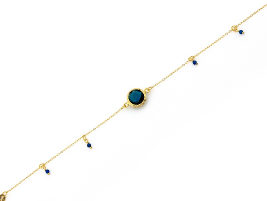 Złota bransoletka z zawieszkami z topazem syntetycznym