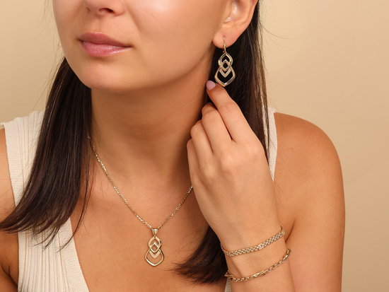 Bransoletka złota taśma z tłoczonych elementów z cyrkoniami