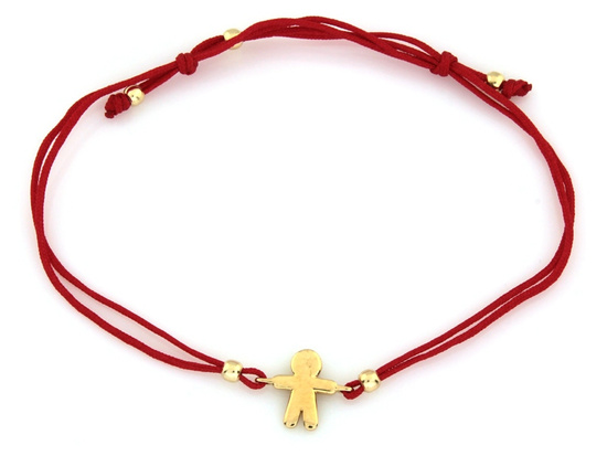 Złota bransoletka na czerwonym sznurku