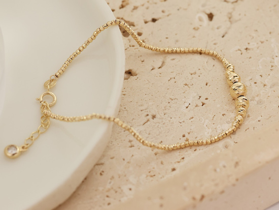 Złota bransoletka modna z kulkami