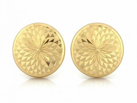 Kolczyki złote okrągłe błyszczące przy uchu pinezki