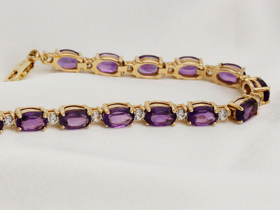 Bransoletka złota z fioletowymi owalnymi cyrkoniami