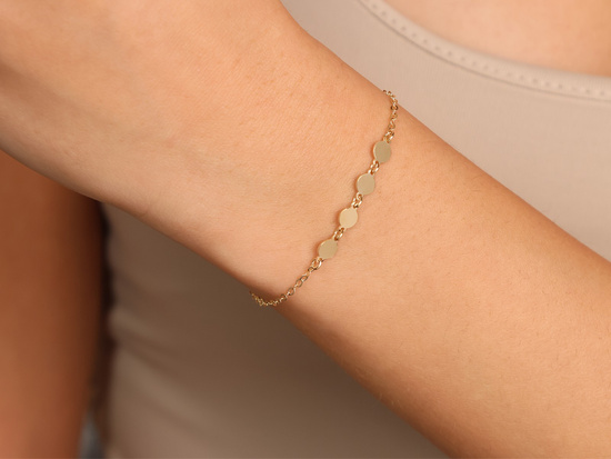 Bransoletka złota z ozdobami kółeczkami błyszcząca