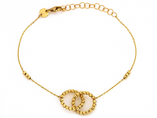 Złota bransoletka dwie obrączki i kuleczki