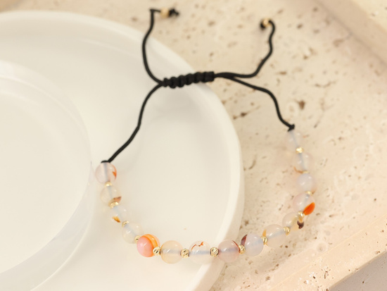 Bransoletka złota kulki i kamienie  na czarny sznurku