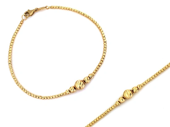 Złota bransoletka z frezowanymi kulkami