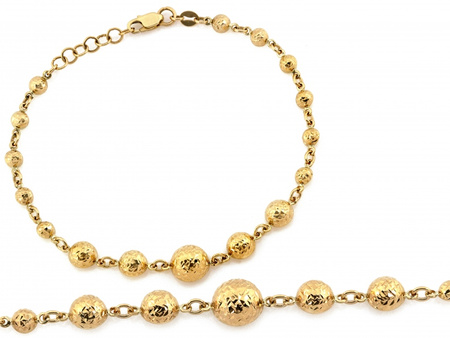 Złota bransoletka z kulkami błyszcząca efektowna