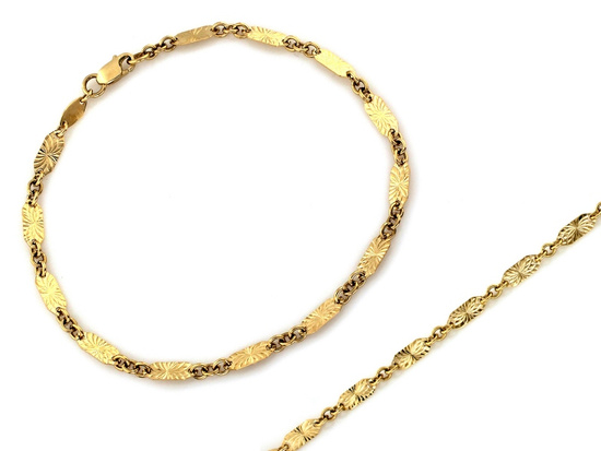 Złota bransoletka z owalnych frezowanych blaszek