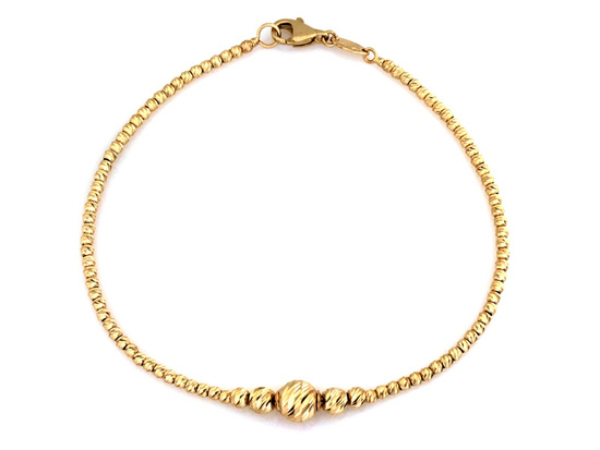 Złota bransoletka z frezowanymi kulkami