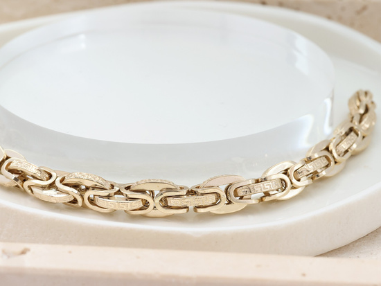 Gruba złota bransoleta z greckim wzorem