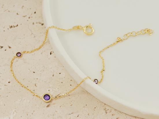 Bransoletka złota z fioletowymi cyrkoniami