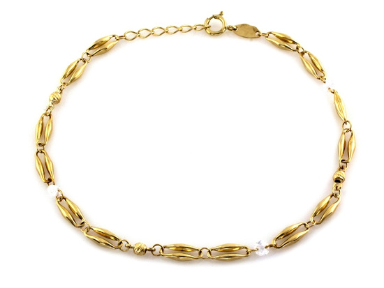 Złota bransoletka z owalnych ogniw i cyrkonii