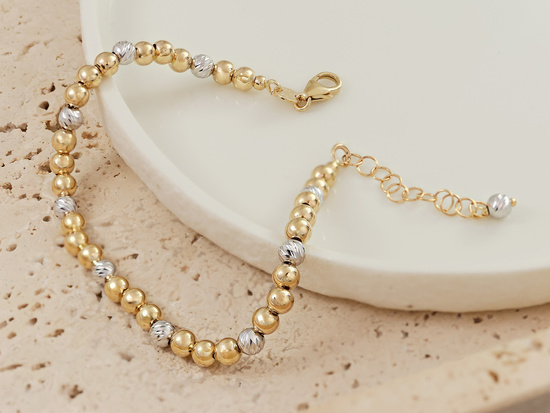 Bransoletka złota z dwukolorowych  kulek 4mm