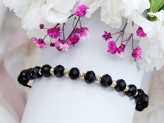 Bransoletka złote kulki i czarne kamienie na czarnym sznurku
