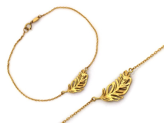 Złota bransoletka piórko