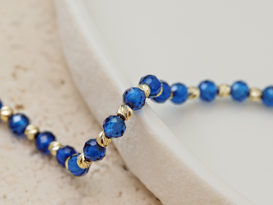 Bransoletka złota z kulkami i syntetycznymi szafirami