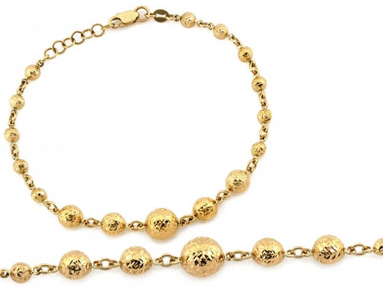 Złota bransoletka z kulkami błyszcząca efektowna