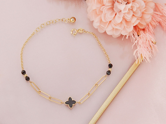 Modna złota bransoletka z modnymi motywami