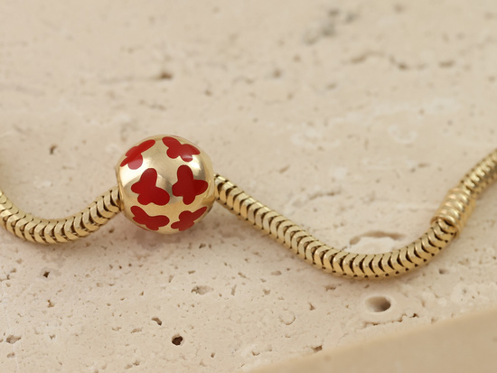 Zawieszka złota kulka do bransoletki przeciągana z motylkami