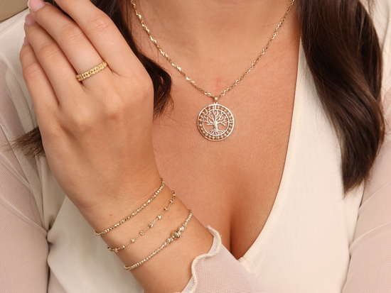 Złota bransoletka z frezowanymi kulkami