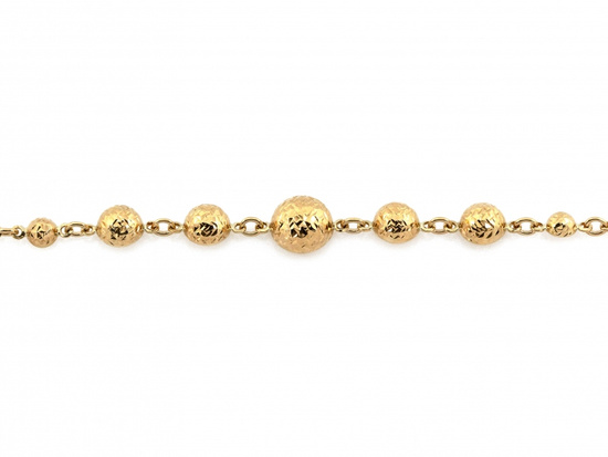 Złota bransoletka z kulkami błyszcząca efektowna