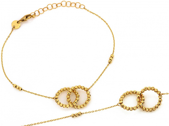 Złota bransoletka dwie obrączki i kuleczki