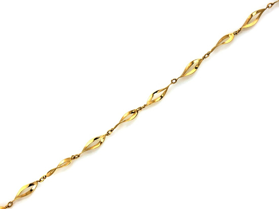 Złota bransoletka z wycinanych skręconych elementów