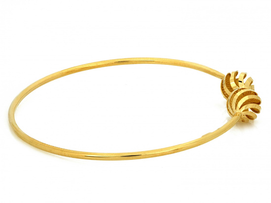 Złota bransoletka sztywna z ażurowymi kulkami