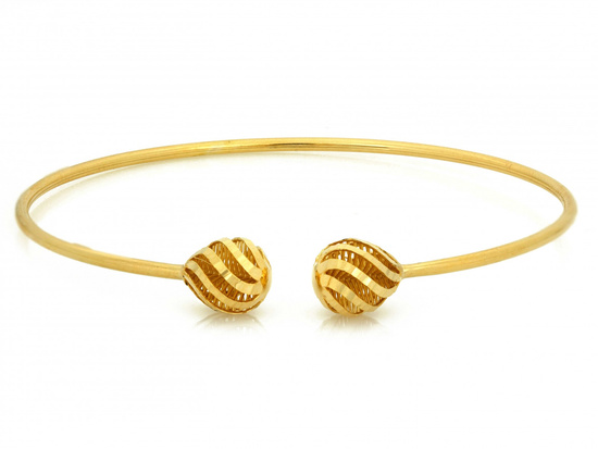 Złota bransoletka sztywna z ażurowymi kulkami