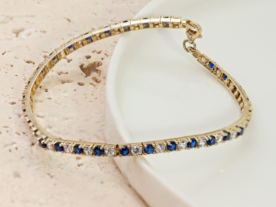 Bransoletka złota z niebieskimi cyrkoniami
