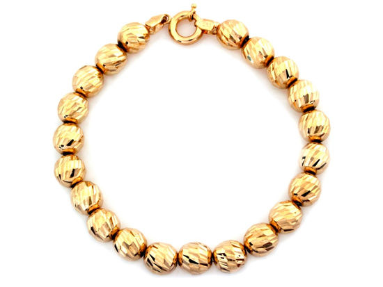 Złota bransoletka z dużych frezowanych kulek