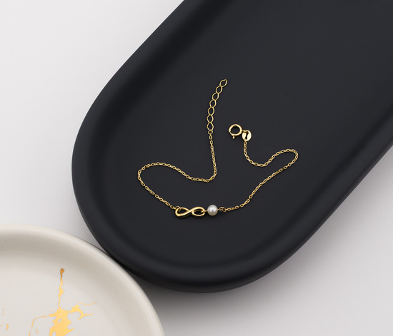 Złota bransoletka 375 nieskończoność z perłą  