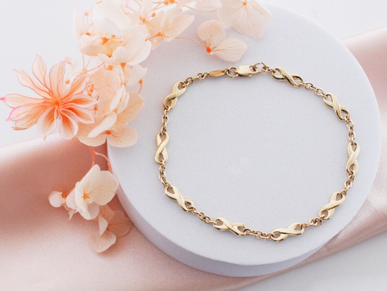 Złota bransoletka elementowa z nieskończonościami