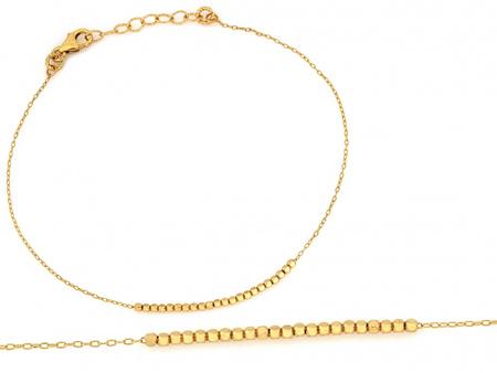 Delikatna złota bransoletka z małymi kostkami